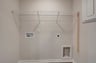 laundry area with a wire shelf
