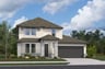 home with brick, windows, garage and landscaped grass 