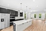 kitchen with stainless steel appliances and pendant lighting