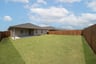 backyard with grass and covered patio