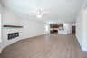 open great room with wood floors and ceiling fan