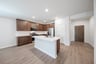 open kitchen with wood floors and island