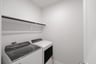 laundry room with tile floors, washer, and dryer
