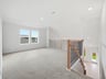 loft with carpet and dual windows