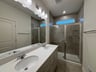 walk-in shower with a window