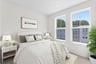 secondary bedroom with two windows