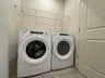 washer, dryer and a wire shelf