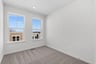 secondary bedroom with two windows