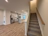great room with access to the stairs