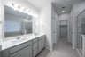 bathroom with white countertops and two sinks 