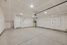 interior of spacious finished two-car garage with recessed ceiling lights