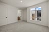 bedroom with gray carpet, large window, white walls, and view of attached bathroom