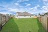 large sideyard with full grass