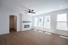 open great room with wood floors and fireplace