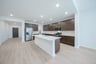 open kitchen with wood floors and island