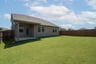 backyard with grass and covered patio