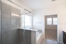 primary bathroom with soaking tub and walk-in shower