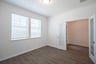 private study with wood floors and french doors