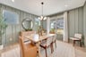 dining room with four windows and a rug