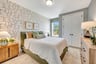 first floor bedroom with a window and a closet