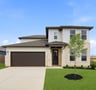 home with brick, windows and landscaped grass and tree 