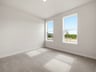 study with carpet flooring and windows