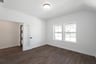 private study with wood floors and french doors