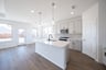 open kitchen with white quartz countertops