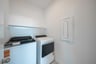 laundry room with included washer and dryer