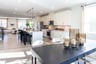 dining area with a large table connecting to the kitchen