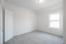 guest bedroom with carpet