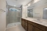 primary bath with an oversized shower with a window