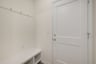 mudroom with a bench with cubbies and hooks