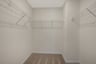 primary walk-in closet with wire shelves