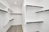 abundant closet space with wooden shelving