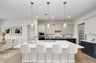 rendered photo of kitchen with bar stools and hardwood flooring