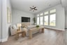 rendered great room photo with wood-look tile flooring and tall ceilings