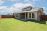 backyard with grass and covered patio