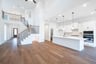 open great room with wood floors and fireplace