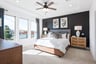 bedroom with carpet and large windows 