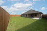 backyard with grass and covered patio