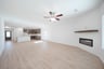 open great room with wood floors and fireplace