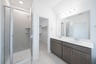primary bathroom with soaking tub and walk-in shower
