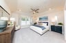 primary bedroom with high ceilings and carpet