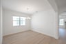 dining room with wood flooring and chandelier 