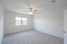 bedroom with carpet and ceiling fan 