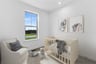 secondary bedroom with carpet, a crib and a window