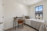 secondary bedroom with a desk