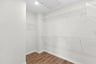 primary walk-in closet with wire shelves