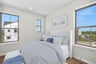 secondary bedroom with three windows